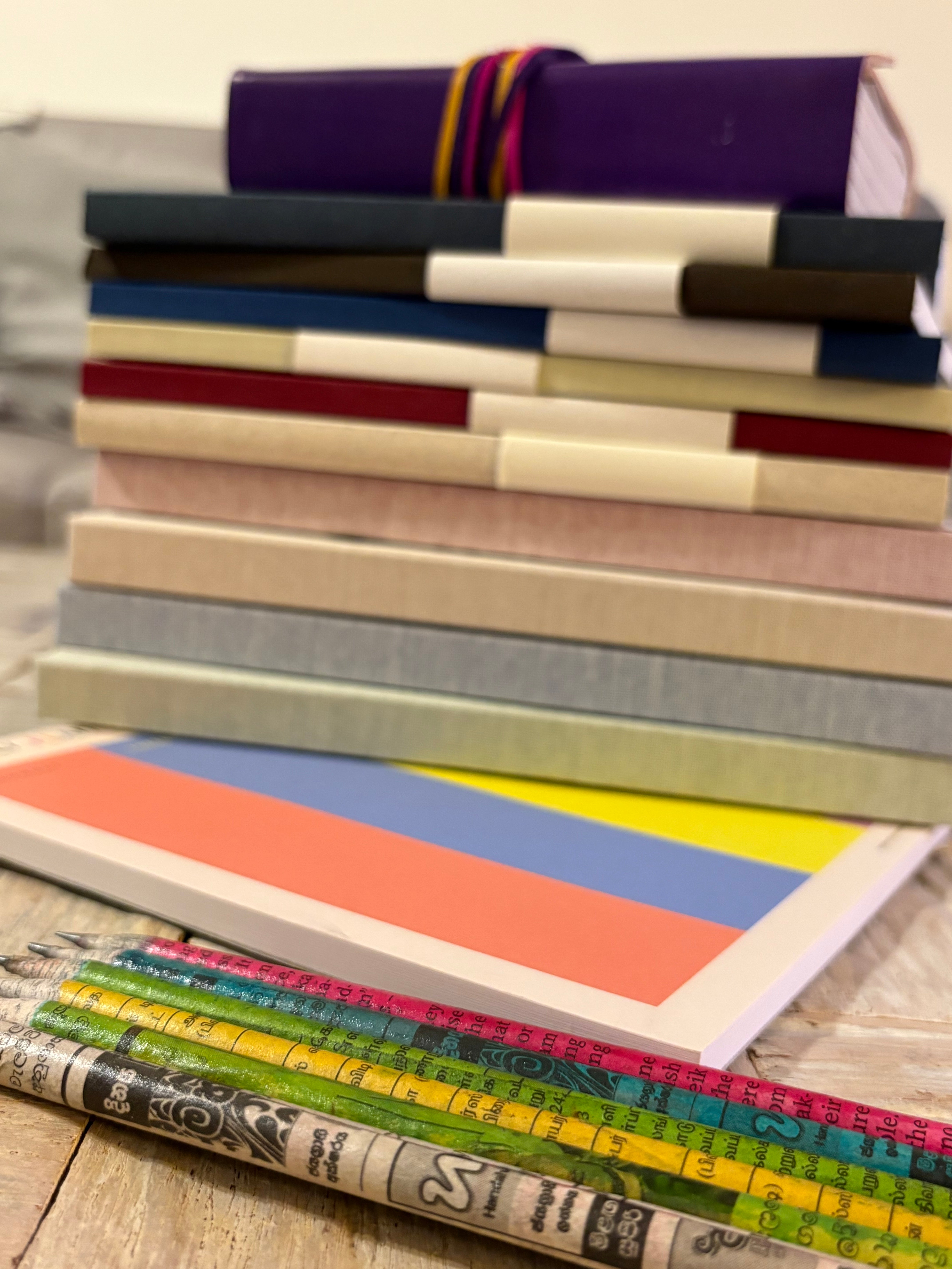 Eco friendly notebooks & recycled newspaper pencils available at The Life Cycle Design