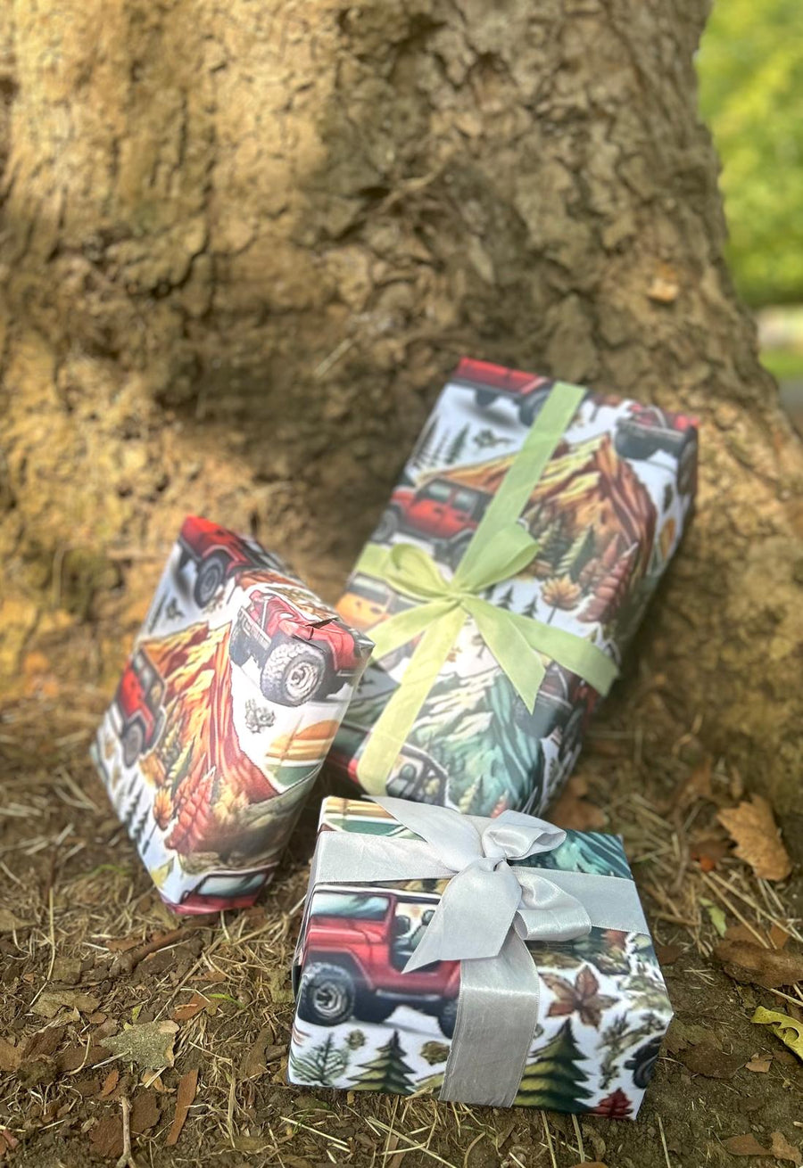 Winter mountain adventures in a 4 x 4 off road vehicle wrapping paper. FSC certified, uncoated 120gsm, 500mm x700mm
