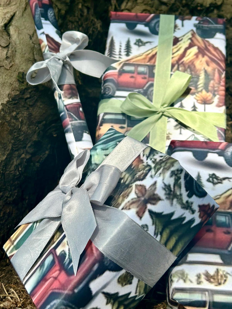 Winter mountain adventures in a 4 x 4 off road vehicle wrapping paper. FSC certified, uncoated 120gsm, 500mm x700mm