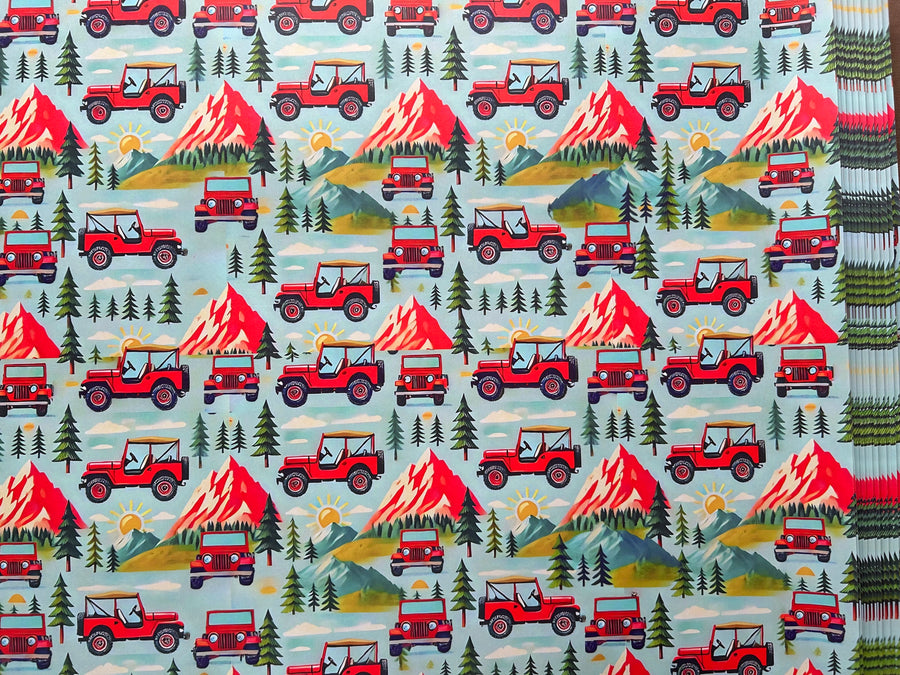 Mountain adventures in a red 4 x 4 off road vehicle wrapping paper. FSC certified, uncoated, 120gsm, 500mm x700mm