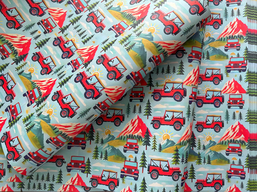 Mountain adventures in a red 4 x 4 off road vehicle wrapping paper. FSC certified, uncoated, 120gsm, 500mm x700mm