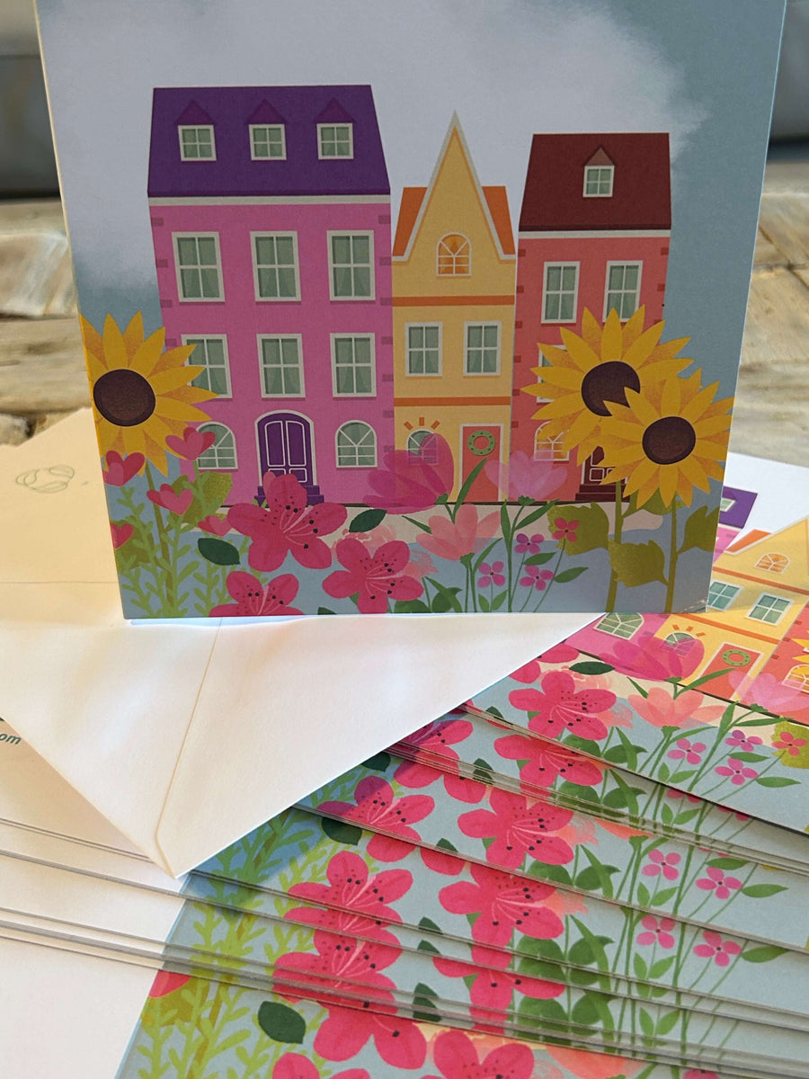 Flowery houses in bloom greeting card with hand embossed envelope. Colourful, FSC certified with printed sunflowers inside. Blank for your message