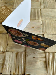 Jalaibl in bowl soft focus design in middle right of card.