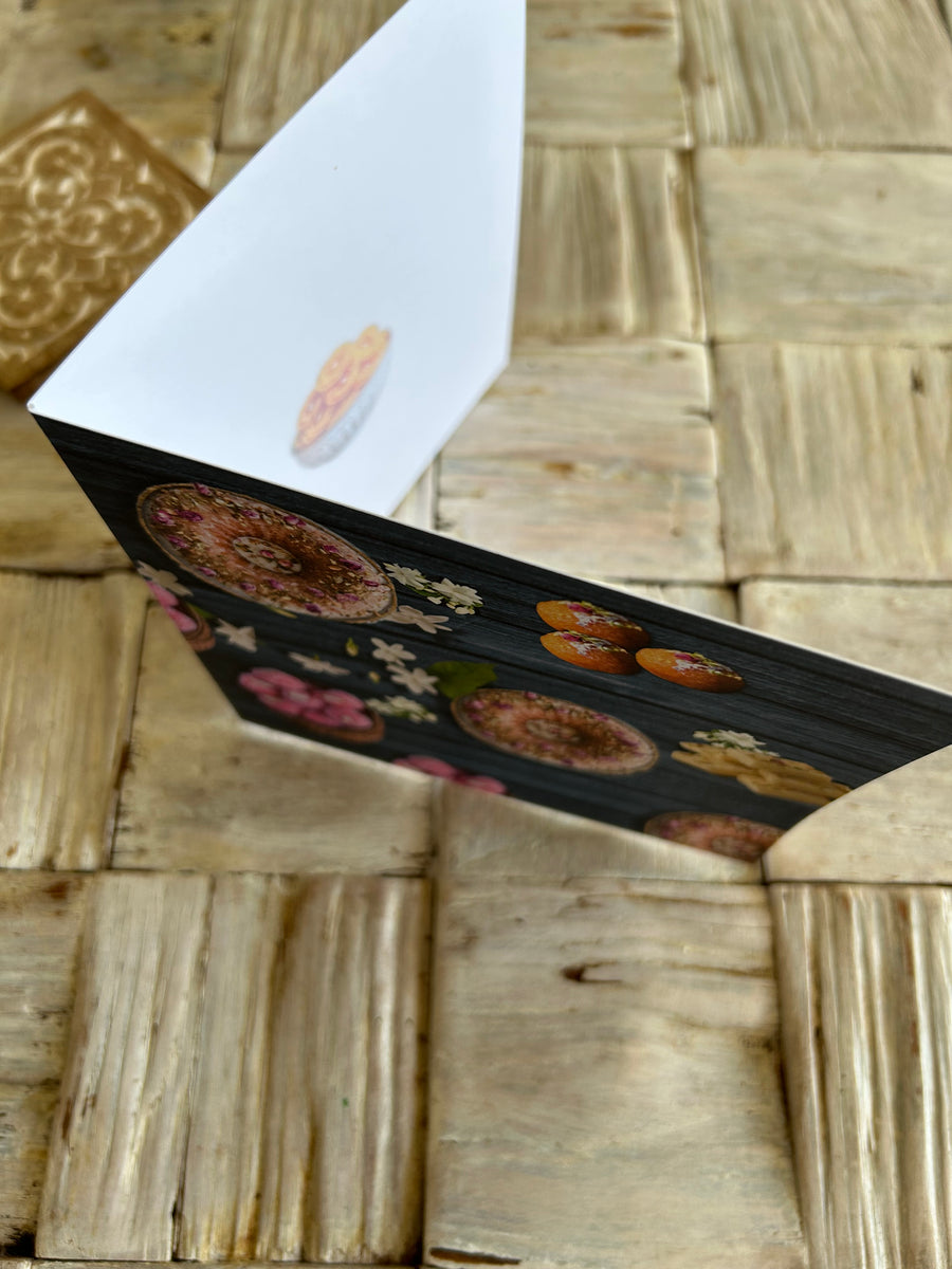 Jalaibl in bowl soft focus design in middle right of card.