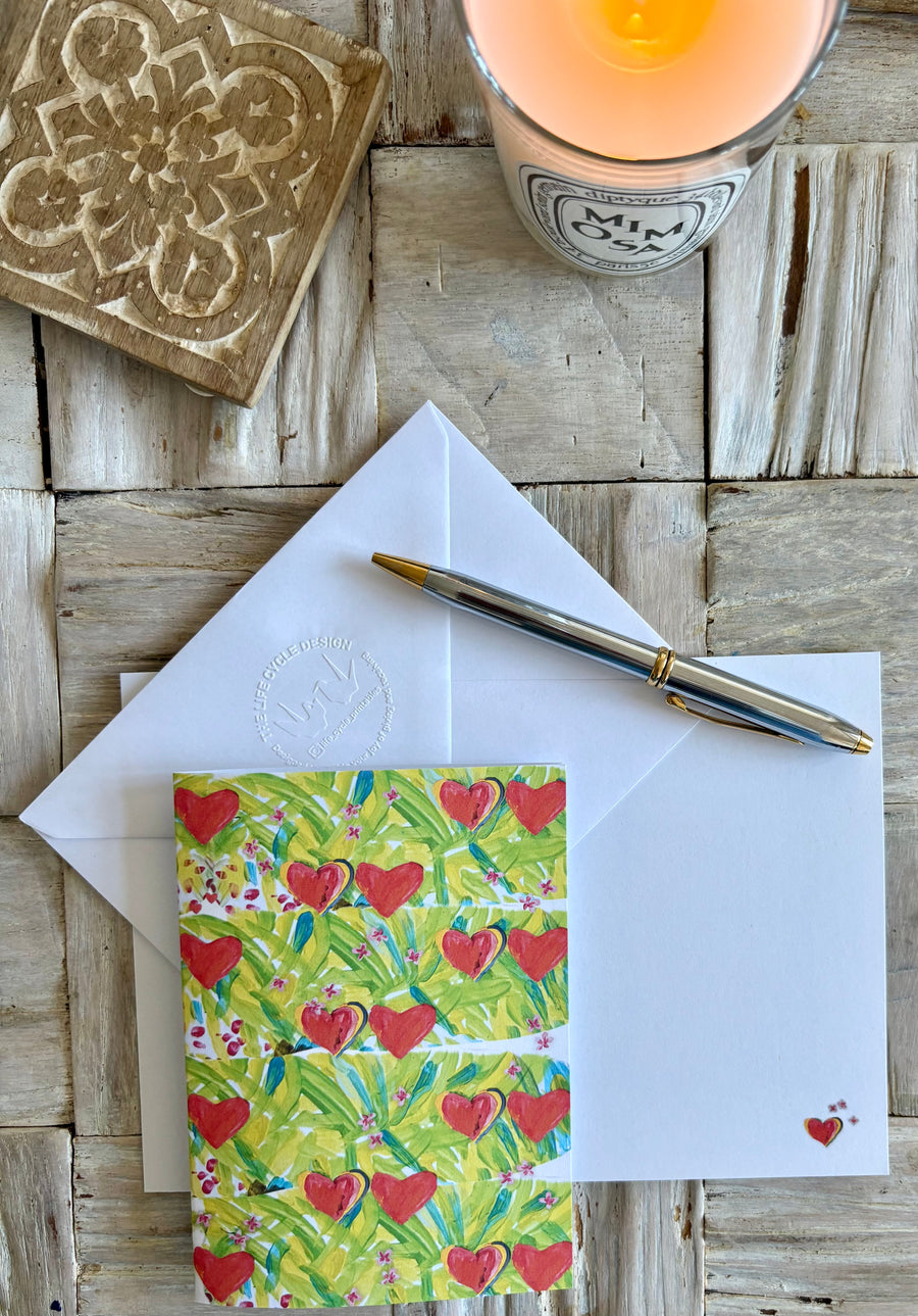 Painted hearts on leaves & flowers greeting card with hand embossed envelope. Small printed hearts inside. Blank for your message