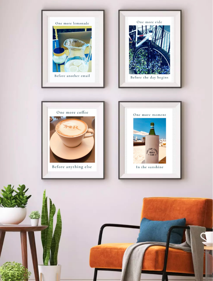 Four framed pictures on a wall above an orange chair with a plant and side table.